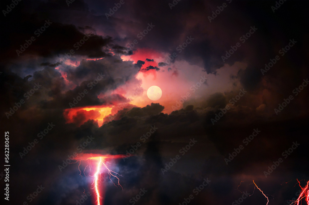 Fork lightning striking down during summer storm and moon
