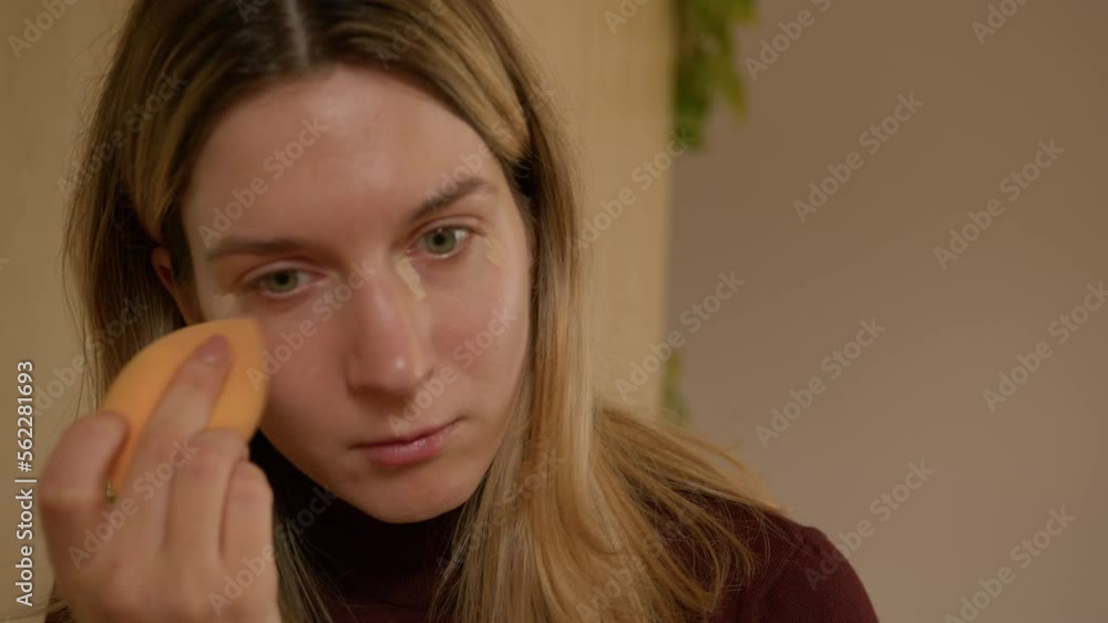 Girl doing makeup on herself at home Girl doing makeup on herself at home