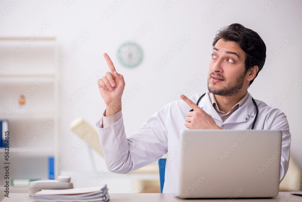 Young male doctor in telemedicine concept Young male doctor in telemedicine concept