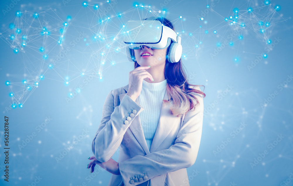 Asian businesswoman with VR headset looking at virtual reality screen. Business, technology, internet iot and networking concept. Asian businesswoman with VR headset looking at virtual reality screen. Business, technology, internet iot and networking concept.
