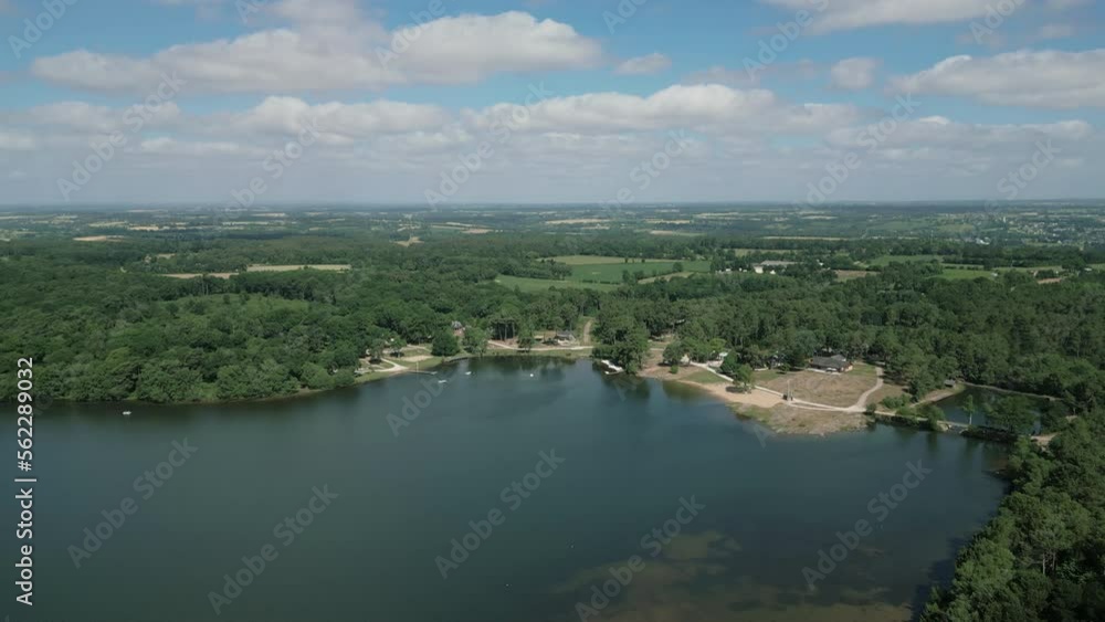 Lake of Trémelin or Tremelin in Brocéliande, Brittany in France. Aerial forward Lake of Trémelin or Tremelin in Brocéliande, Brittany in France. Aerial forward