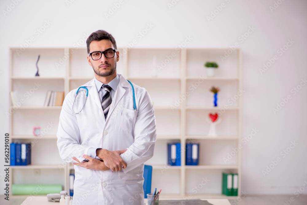 Young male doctor working at the hospital