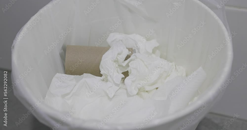 Close-up throw used tissues into the trash can in clean and modern bathroom. 4k video footage. Close-up throw used tissues into the trash can in clean and modern bathroom. 4k video footage.