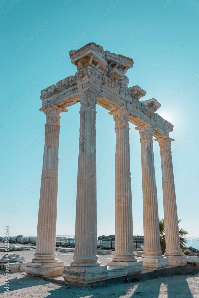 The ruins of the ancient temple of Apollo in the city of Side, Antalya province, Turkey against the blue sky.