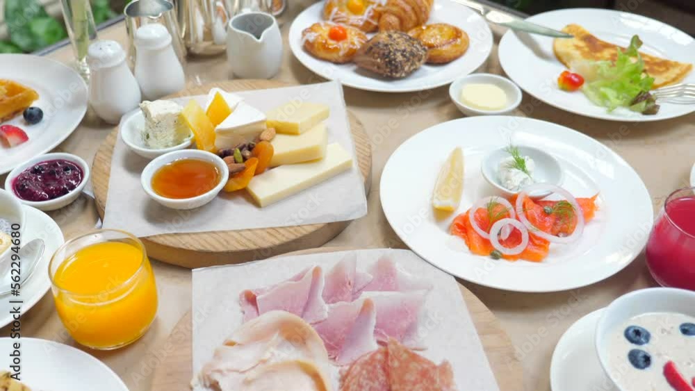 Table full of various fresh food in luxury modern restaurant Table full of various fresh food in luxury modern restaurant