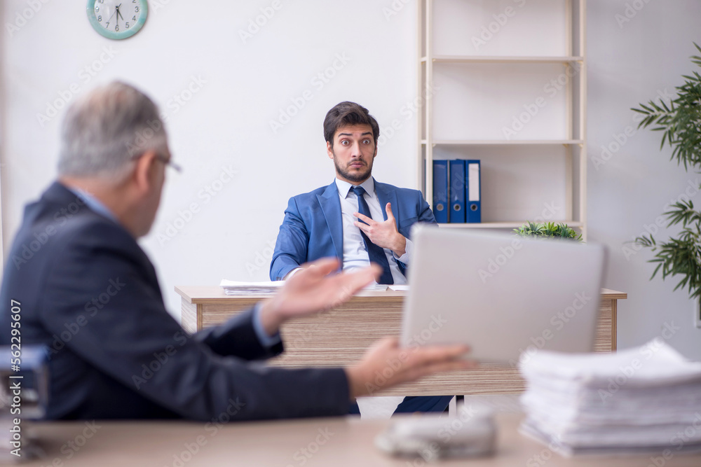 Two male colleagues working in the office Two male colleagues working in the office