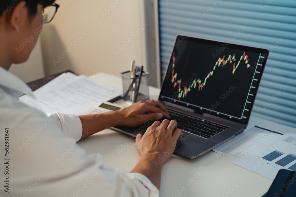 Asian businessman In the Data Mining Center Statistician with Monitors Displaying business finance technology and investment. Stock Market Investments Asian businessman In the Data Mining Center Statistician with Monitors Displaying business finance technology and investment. Stock Market Investments