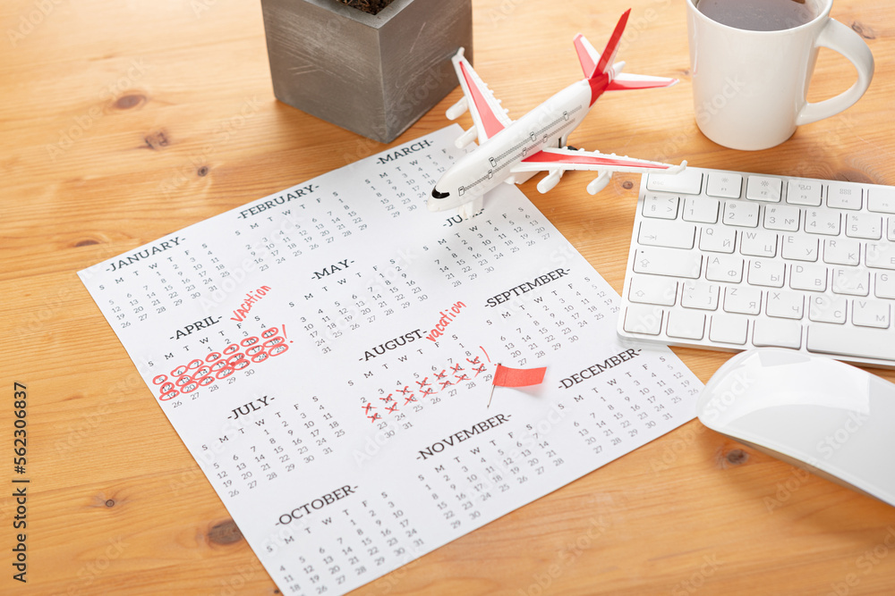 Obraz premium Planner Calendar and agenda reminders, work from home. for plan daily meeting and note holiday trip in diary at office desk. 2023 calendar reminder concept.