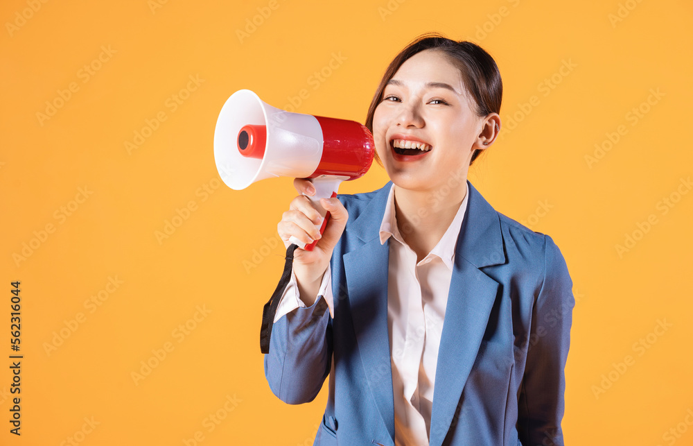 Photo of young Asian businesswoman holding megaphone on background Photo of young Asian businesswoman holding megaphone on background
