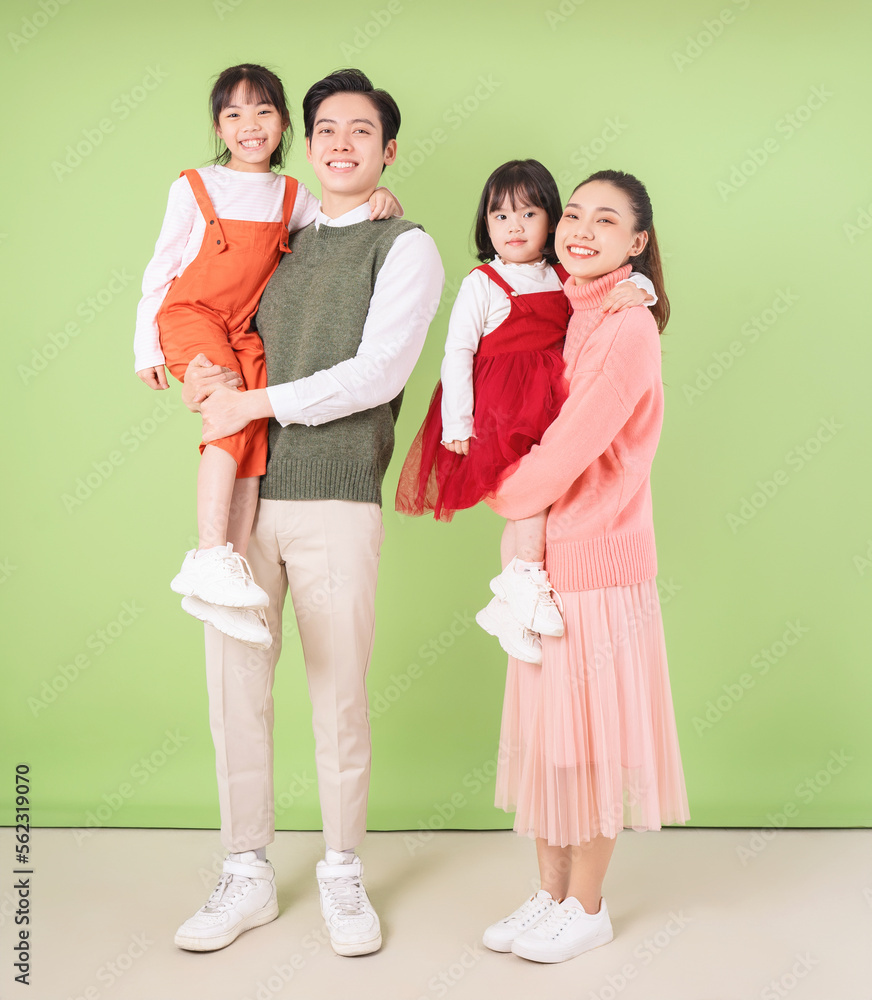 Fototapeta premium Image of young Asian family on background