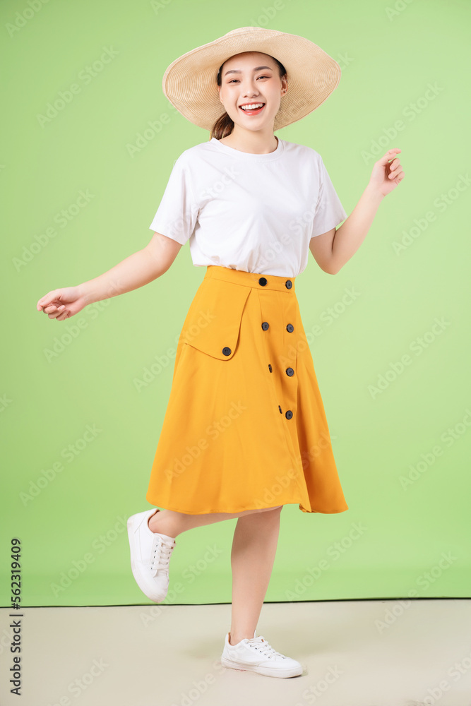 full length image of young Asian woman on background full length image of young Asian woman on background