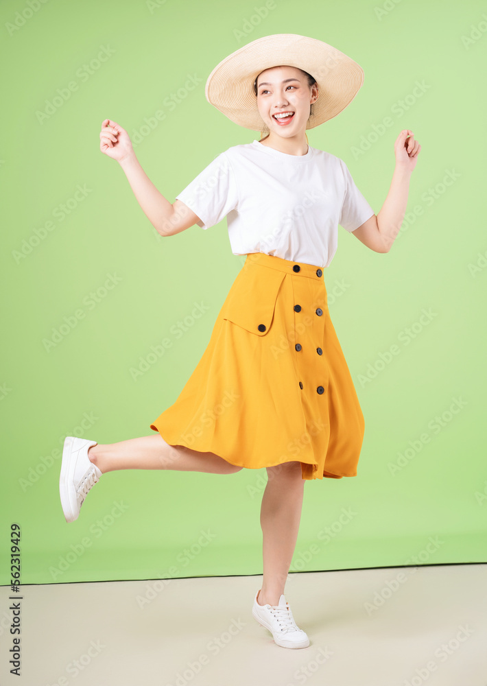 full length image of young Asian woman on background full length image of young Asian woman on background