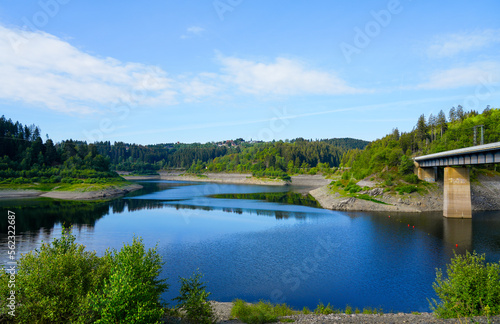 Oker reservoir near Altenau in the Harz Mountains. View from the Okertalsperre to the Oker See and the surrounding landscape. Idyllic nature by the water. 