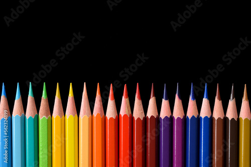 Color pencils isolated on black background. Close up