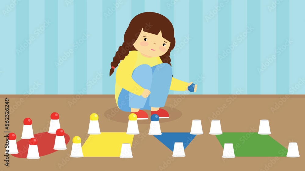 The girl on the floor arranges cups with multi-colored chips The girl on the floor arranges cups with multi-colored chips