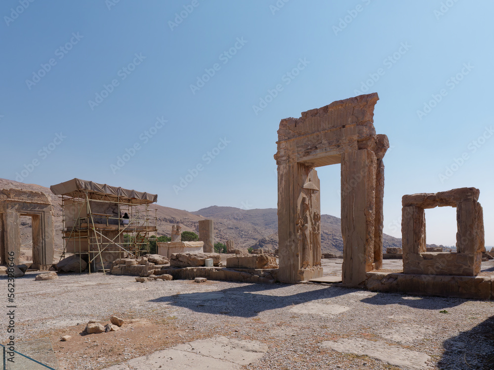 View of the ruins of the Hadish Palace with a blue sky background in the ancient city of Persepolis, Shiraz, Iran