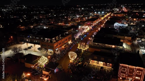 Wallpaper Mural Slow tracking wide arial drone shot flying high over Denver Christmas parade  Torontodigital.ca