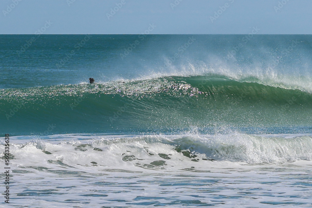 Fototapeta premium Surfing at Spanish House in Sebastian Inlet state park in Florida