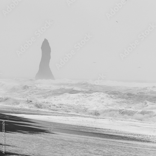 High rock and stormy sea monochrome landscape photo. Beautiful nature scenery photography with fog on background. Idyllic scene. High quality picture for wallpaper, travel blog, magazine, article © Gypsy On The Road