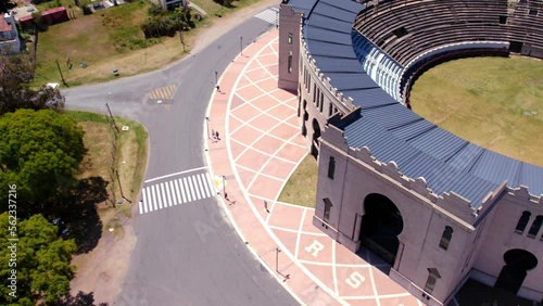 Aerial view of a couple of friends walking around the Real de San Carlos bullring in Colonia del Sacramento, Uruguay on a sunny day. photo