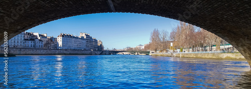 Paris, ile saint-louis, view under the Pont-Marie bridge, with the Arcole bridge in background, beautiful ancient buildings
 photo
