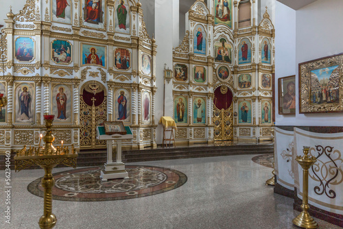 Altar with icons and candles in an Orthodox Christian church. Faith, religion and culture.