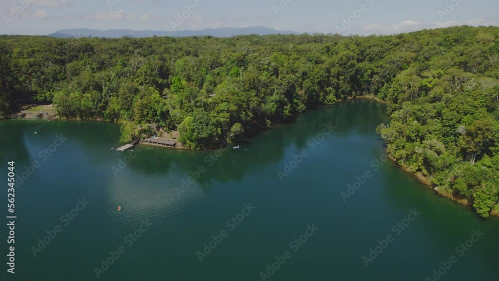 Touristic Lake Eacham In Atherton Tableland, Queensland, Australia - aerial pullback Touristic Lake Eacham In Atherton Tableland, Queensland, Australia - aerial pullback