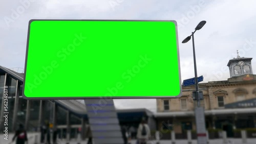 4K Large Green Screen Advertising Board - City Street scene showing high street and transport hub with billboard for targeted ads towards commuters and shoppers photo