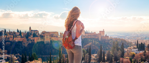 Woman tourist looking at Ancient arabic fortress Alhambra- Granada in Spain