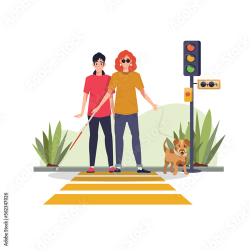 Blind woman crossing the road at a traffic light with a guide dog