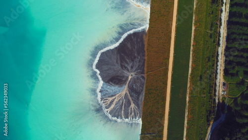 Top down aerial view over natural texture - abstract industrial lake water patterns. Turquoise waternature poluttion photo