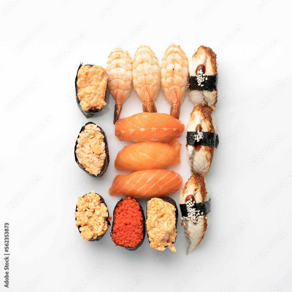 Japanese sushi set isolated on white background. Healthy oriental food. Wellness concept. Flat lay. View from above. Copy space. Japanese sushi set isolated on white background. Healthy oriental food. Wellness concept. Flat lay. View from above. Copy space.