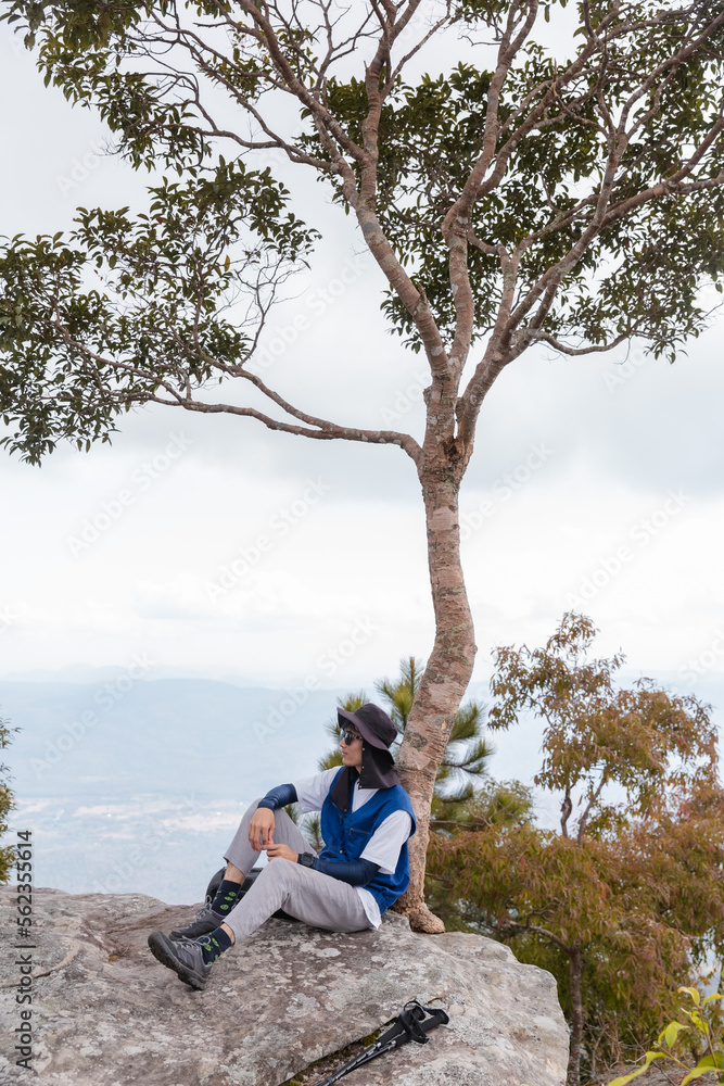 Man and backpacker sitting enjoying the view