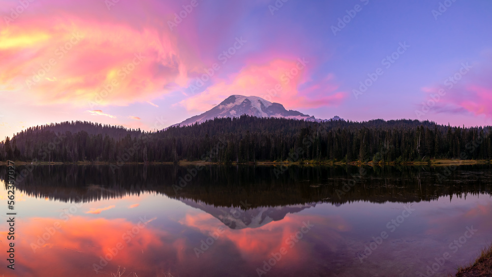 Fototapeta premium Mt Rainier reflected in Reflection Lake at purple sunset in Washington's Mount Rainier National Park