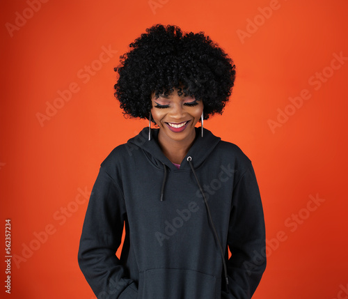 A lady on afro, wearing a black hoodie