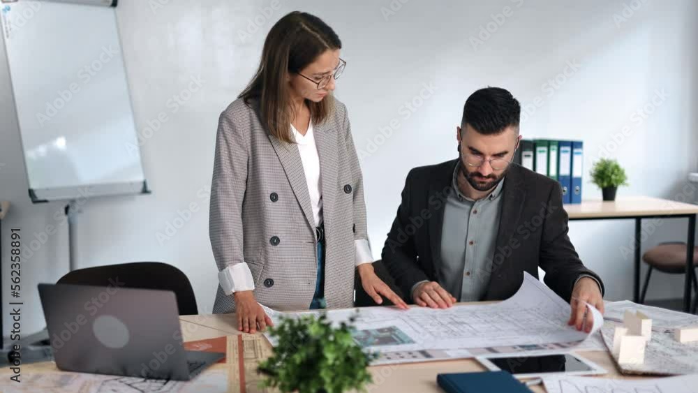 Architect engineering business meeting woman contractor and man boss discuss blueprint project plan Architect engineering business meeting woman contractor and man boss discuss blueprint project plan