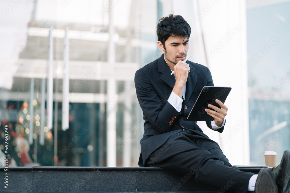 Young stressed Asian businessman working, Businessman thinking too much work concept in the office. Young stressed Asian businessman working, Businessman thinking too much work concept in the office.