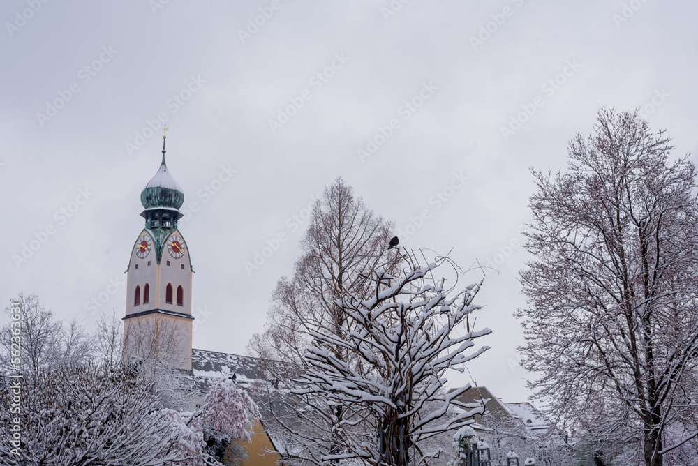 church in the snow, winter in the city, panorama. Rosenheim, Germany