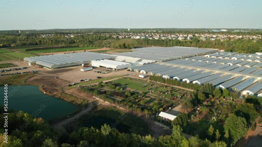 Aerial, agricultural industrial area with rows of greenhouse nurseries growing food