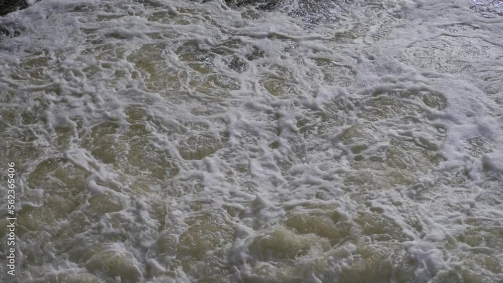 Wake pattern generated by cargo ferry with wave foam and bubbles on water surface. Wake after cargo boat Wake pattern generated by cargo ferry with wave foam and bubbles on water surface. Wake after cargo boat