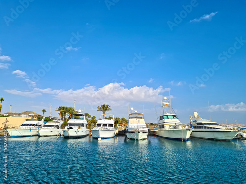 Photography White beautiful yachts are moored at the pier. Marine vehicle.