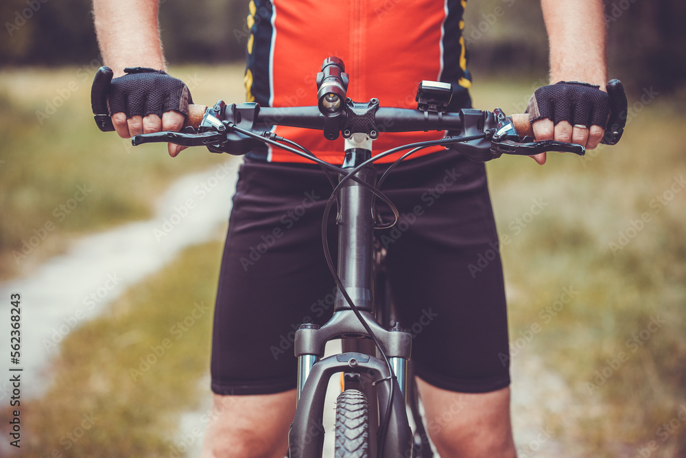 man cyclist rides in the forest on a mountain bike. man cyclist rides in the forest on a mountain bike.