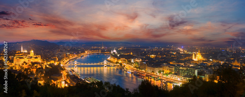 Budapest night panorama view. Long exposure (trees in the foreground out of focus and some in motion blur).