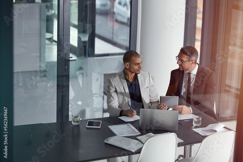 Business team, tablet and planning collaboration online for finance strategy or partnership. Management men together in a meeting discussion with documents and internet for tax audit report in office