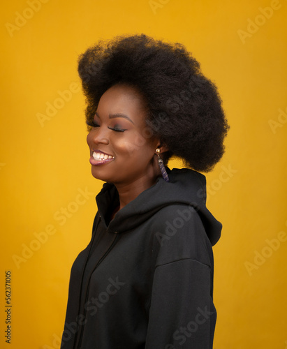 beautiful black model wearing a black hoodie
