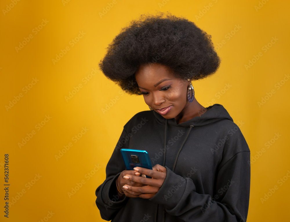 Young lady using a cell phone Young lady using a cell phone