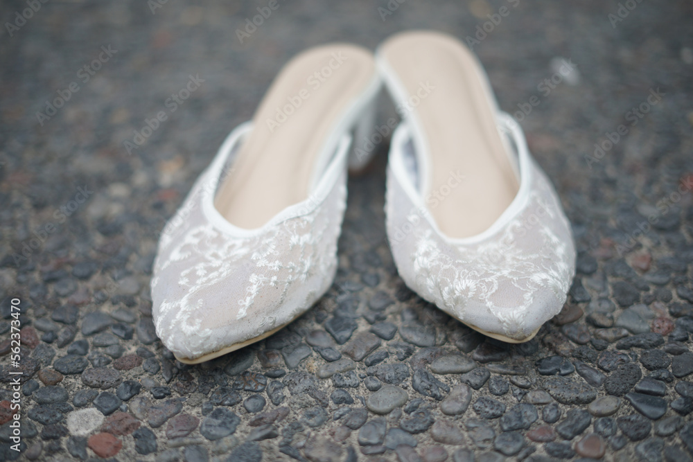 Obraz premium A Pair of Shoes for Bride in a Traditional Wedding Ceremony in Indonesia