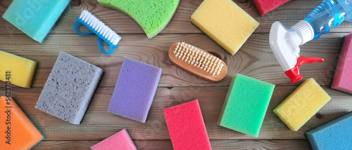 Kitchen cleaning sponge background with copy space. Flatlay. Assortment of section of household goods and chemicals in store. Hardware shop. Space for text. Banner or header for the site. Top view