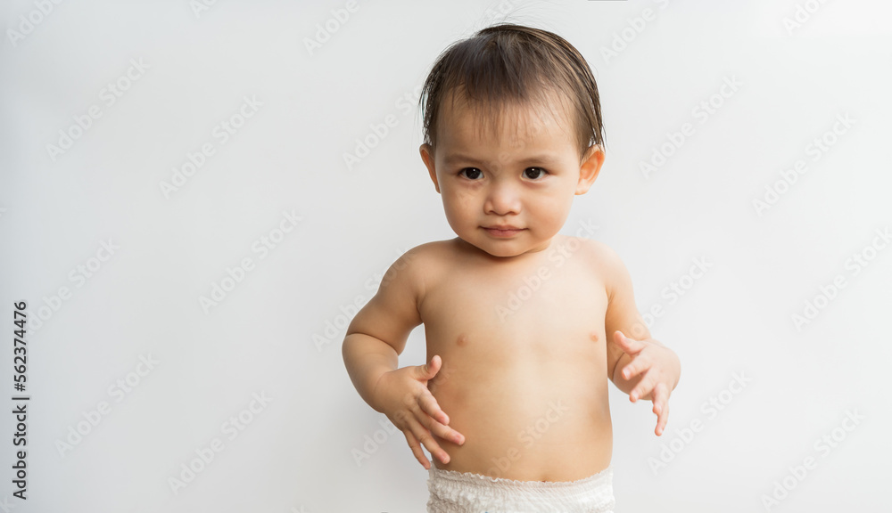The little boy made a gesture cheerful and lively. Child funny face laughing on white isolated background. Son is so cute and funny. Family relationships concept The little boy made a gesture cheerful and lively. Child funny face laughing on white isolated background. Son is so cute and funny. Family relationships concept