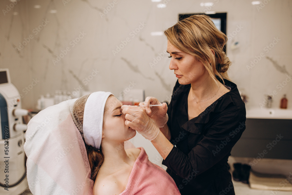 Cosmetologist makes injections on the face. Spa concept relaxation and self-care. Cosmetologist makes injections on the face. Spa concept relaxation and self-care.